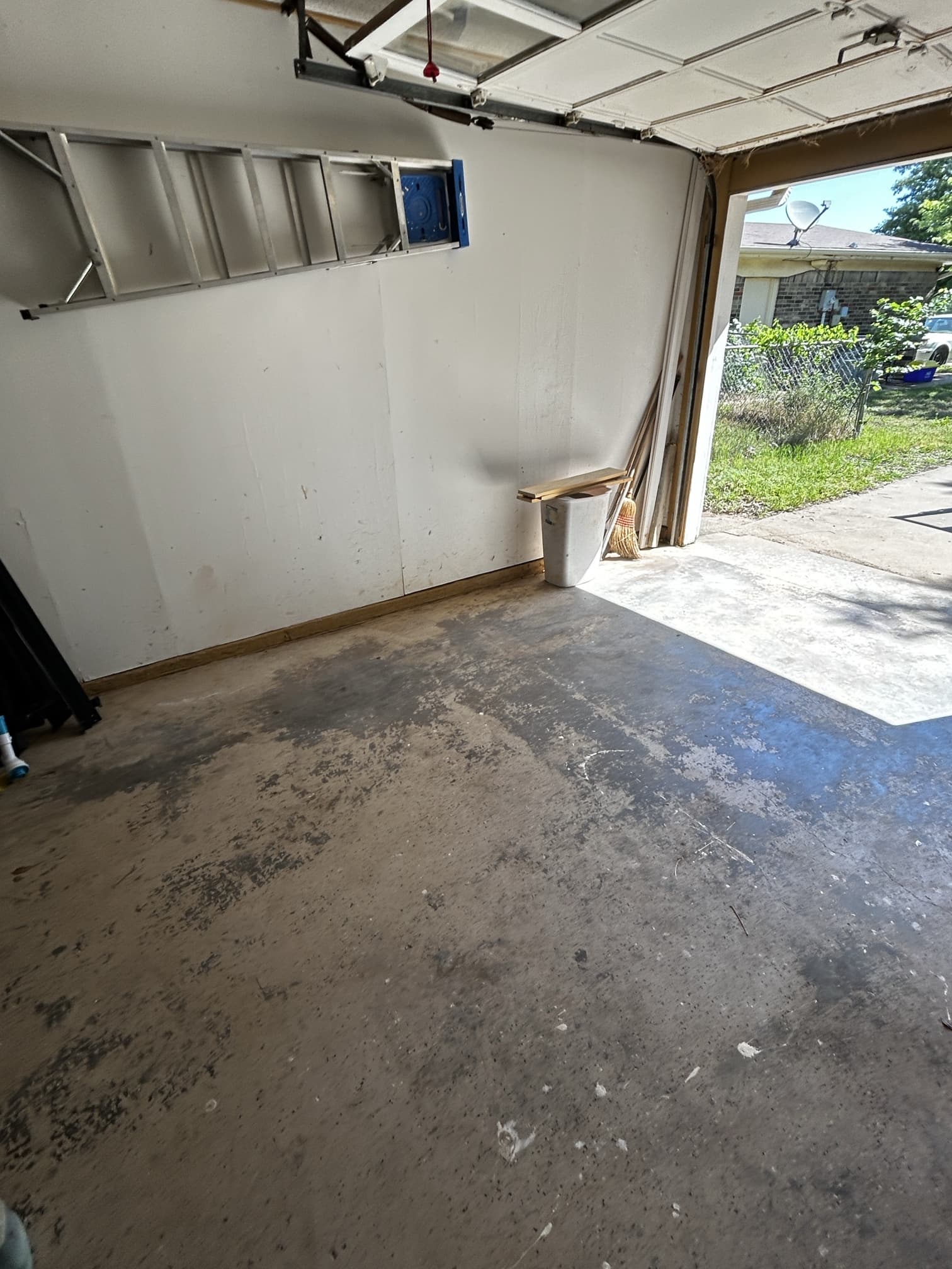 Garage after junk removal — completely cleared out and clean